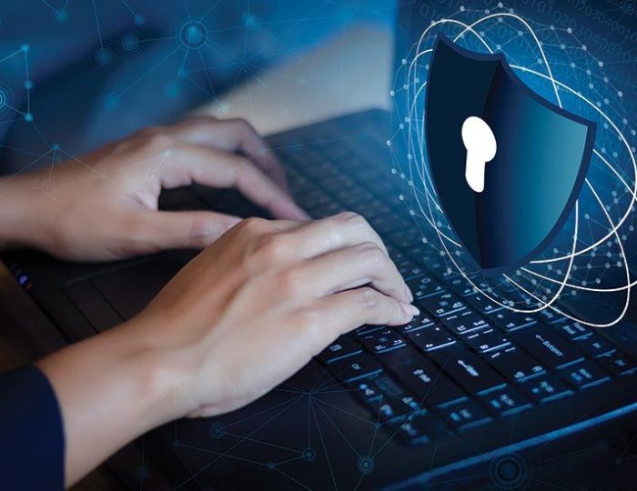 Endpoint Protection shield securing a business laptop for remote work.