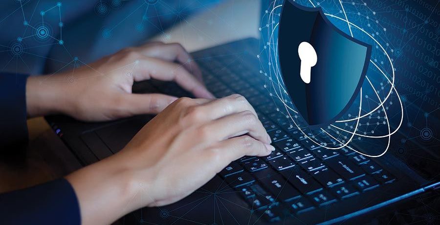 endpoint-protection-remote-work-security Endpoint Protection shield securing a business laptop for remote work.